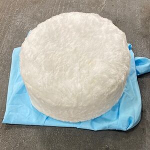 Inflatable ottoman with white cover